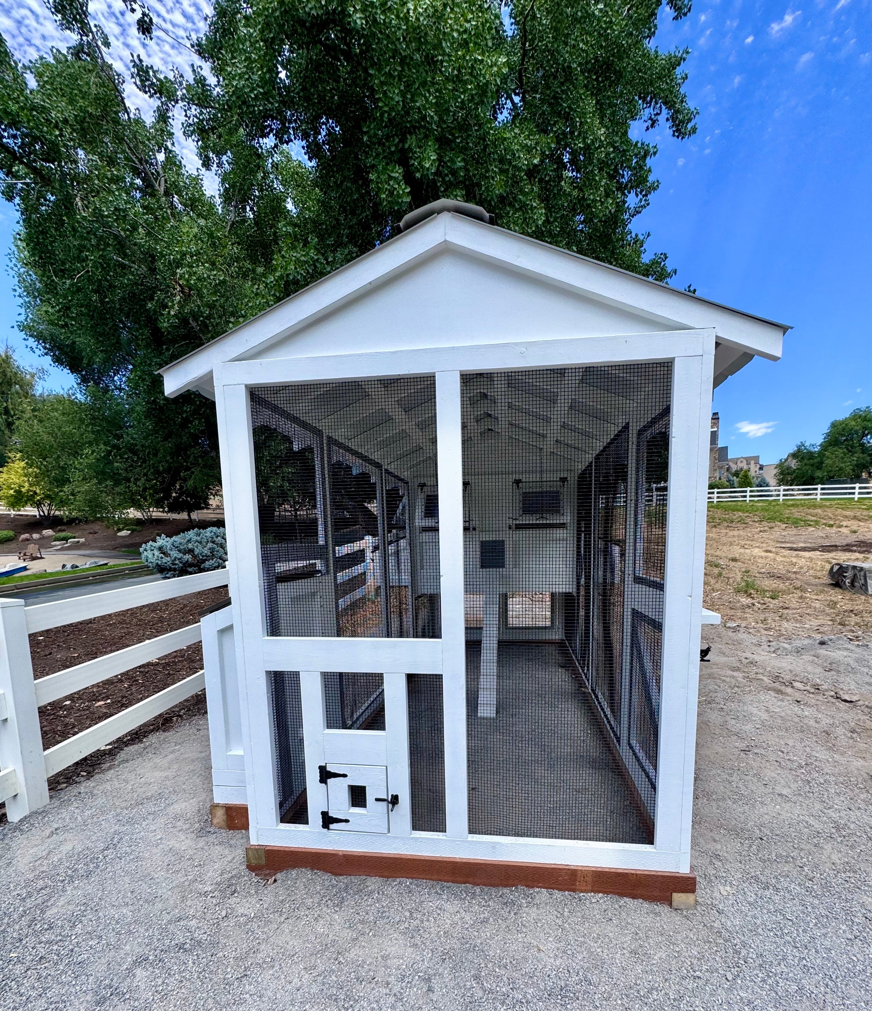 A modern, custom chicken coop finished with premium materials and add-ons features to compliment the keeper's home and surrounding property.